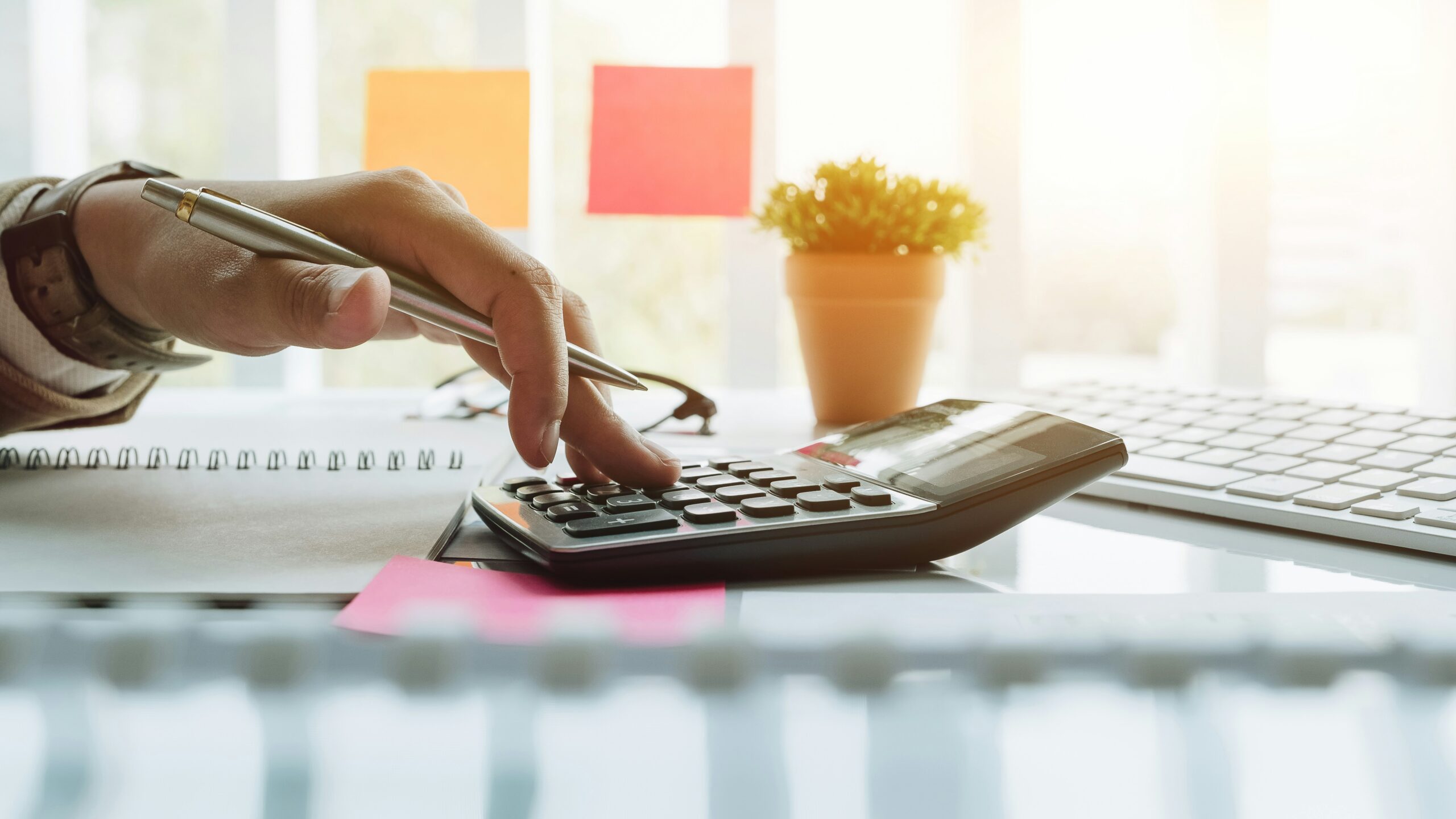 A businessperson using a calculator