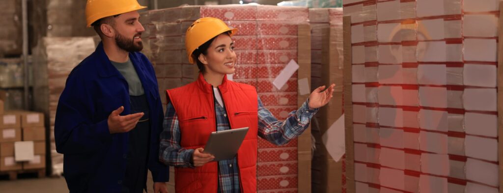 Two facility managers in a warehouse