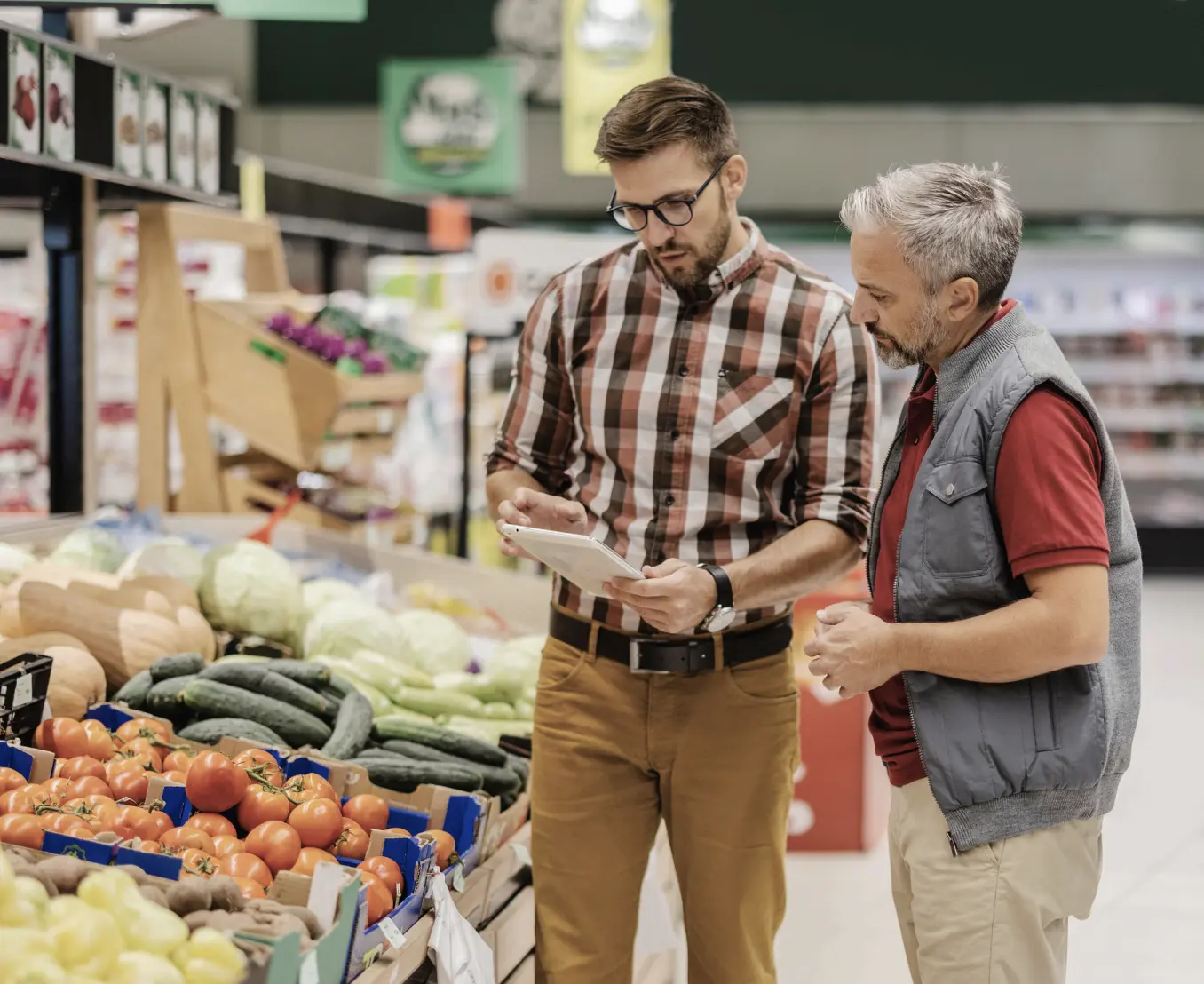 Two men looking at tablet
